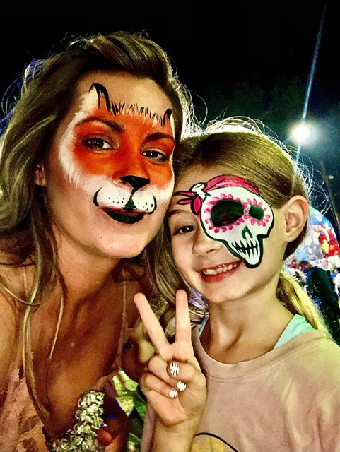 Picture of Robin and her daughter wearing face paint